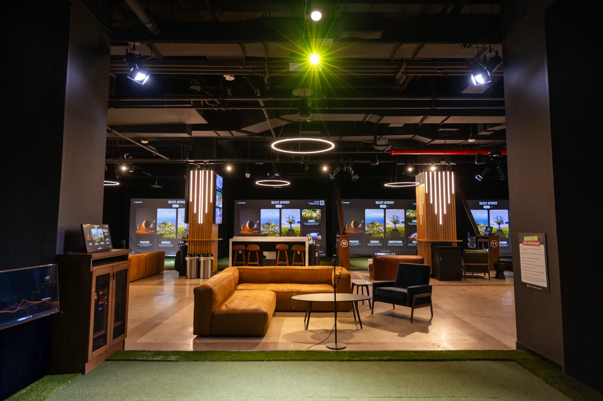 Five Iron Golf simulator bays and shared social space